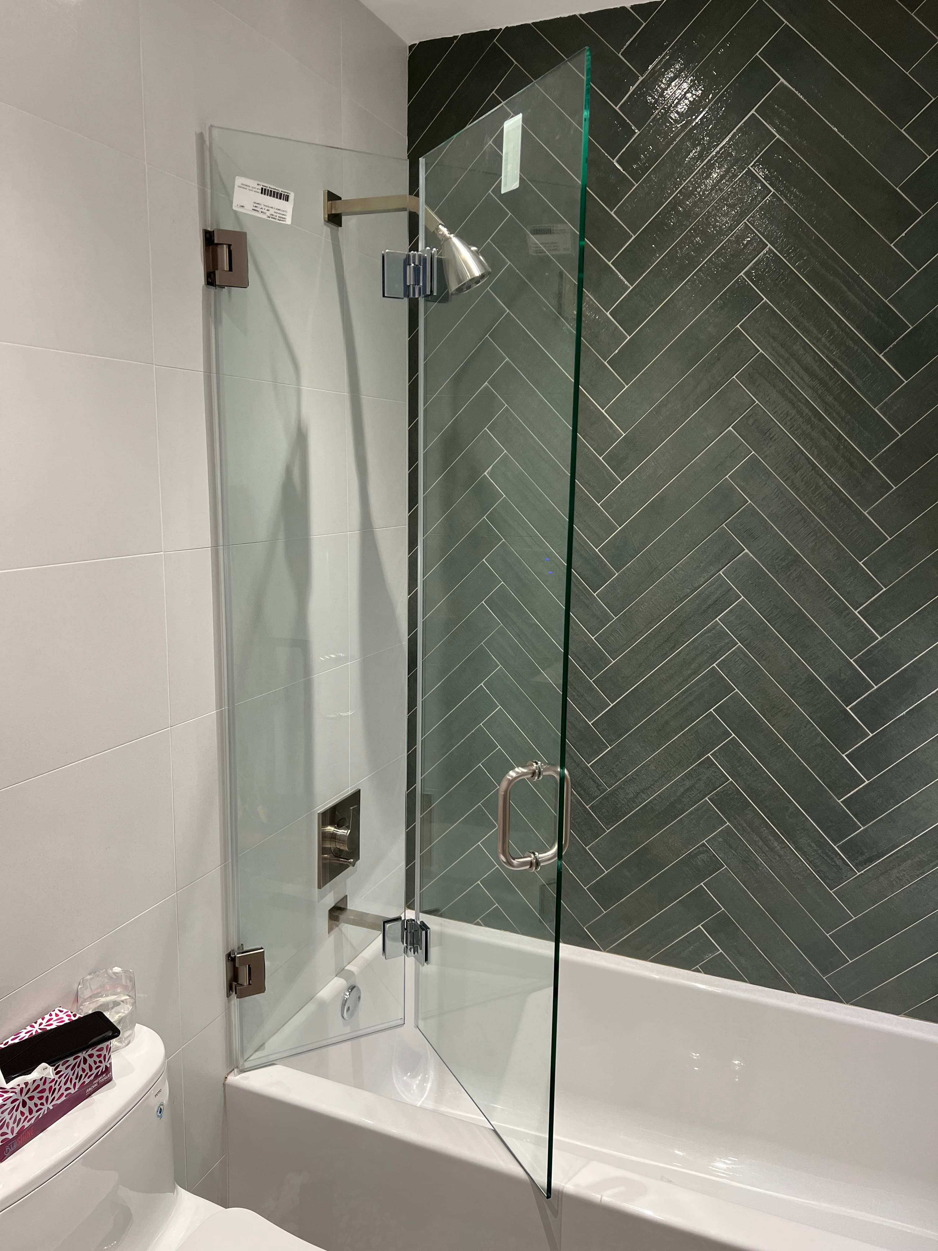 Folding Shower Door - Accordion-style door for ultimate space efficiency.